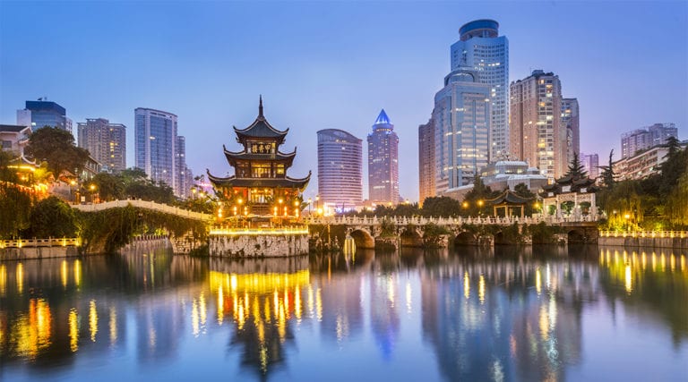 Cityscape of Guiyang at night, Jiaxiu Pavilion on the Nanming River. Located in Guiyang City, Guizhou Province, China.