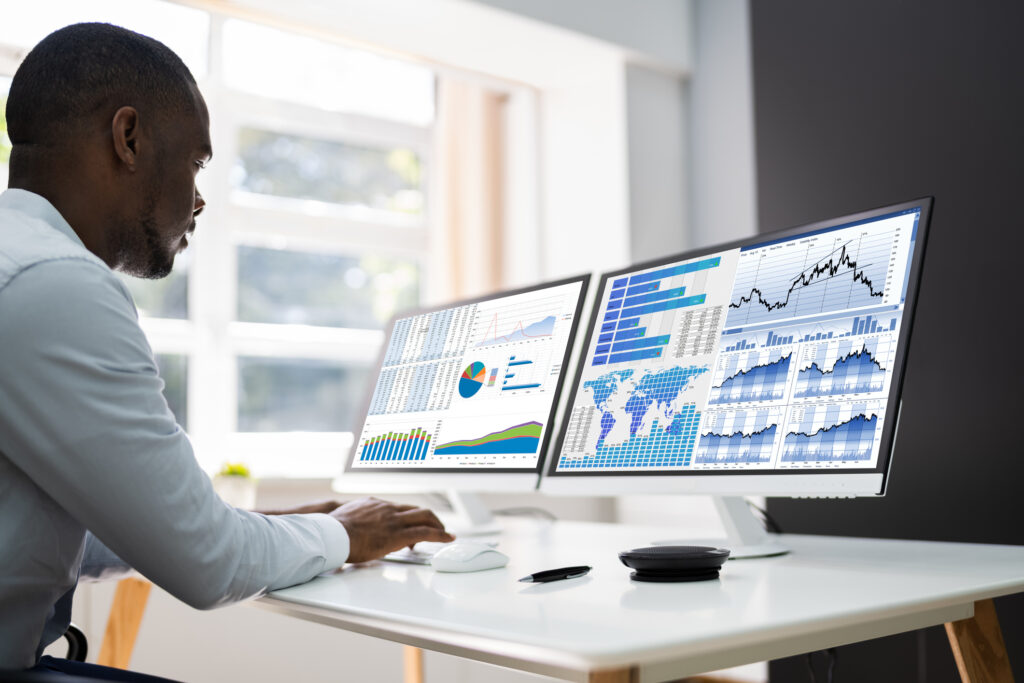 Predictive Business Analytics. African American Analyst Using Computer