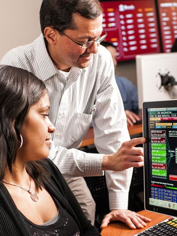 teacher working with student